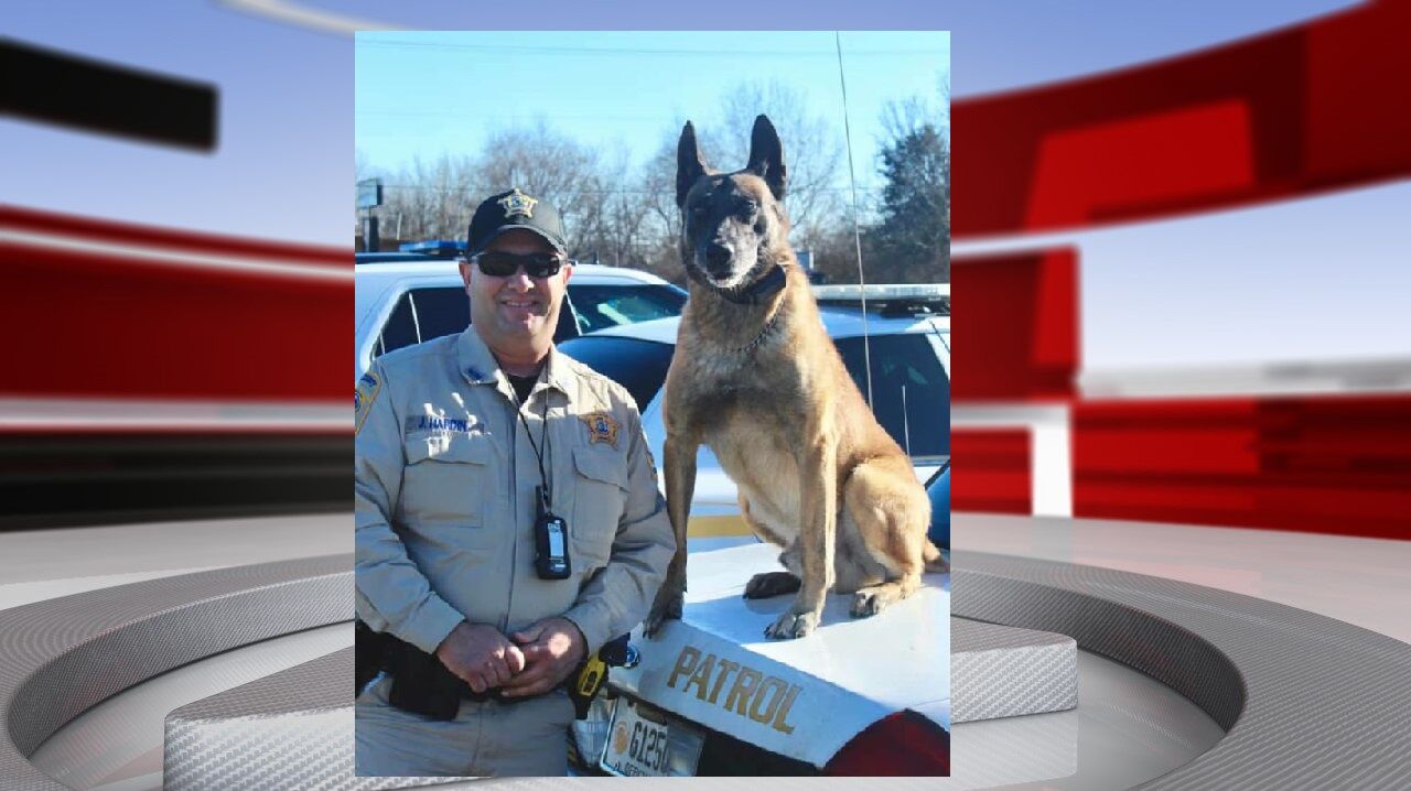 Nelson County K9 dog with officer photo.jpg